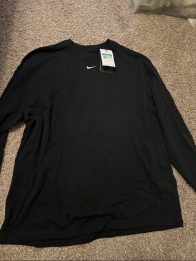 The Nike Black Long Sleeve Tee with White Swoosh Oversized Fit